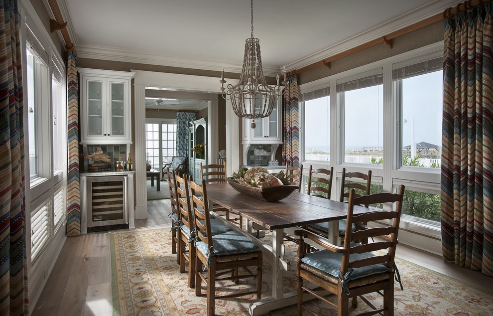 Photo of a beach style separate dining room in Charleston with brown walls, dark hardwood floors and no fireplace.