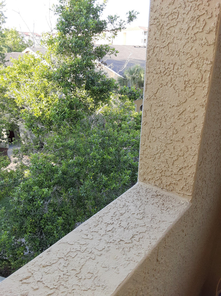 Ideas for securing potted plants onto stucco ledge on apt patio?