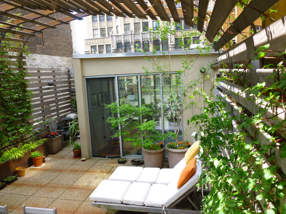 Photo of a large modern rooftop deck in New York with a vertical garden.