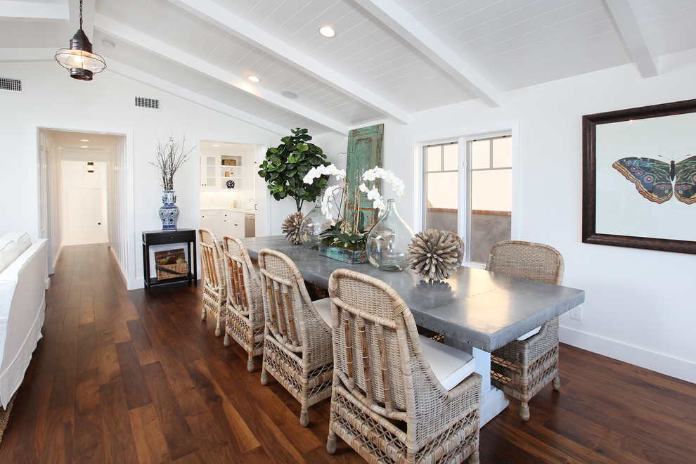 Photo of a traditional dining room in Orange County with white walls and dark hardwood floors.