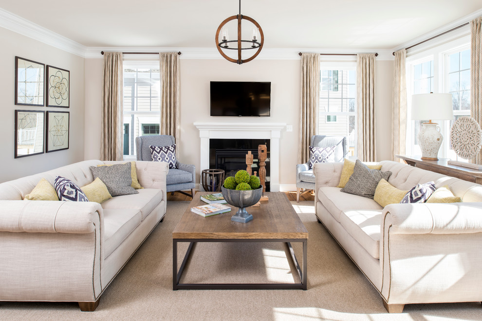 Inspiration for a traditional family room in DC Metro with beige walls, a standard fireplace and a wall-mounted tv.