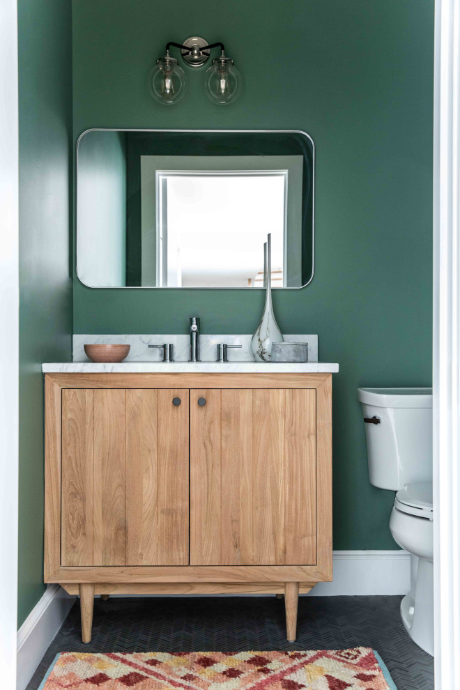This is an example of a mid-sized midcentury bathroom in Portland Maine with flat-panel cabinets, light wood cabinets, green walls, slate floors, marble benchtops, black floor, grey benchtops, a single vanity and a freestanding vanity.
