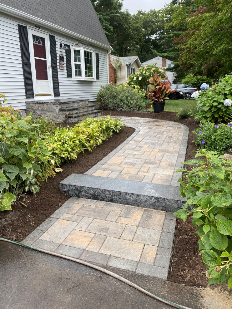 Mid-sized traditional front yard full sun garden in Boston with with path and concrete pavers.