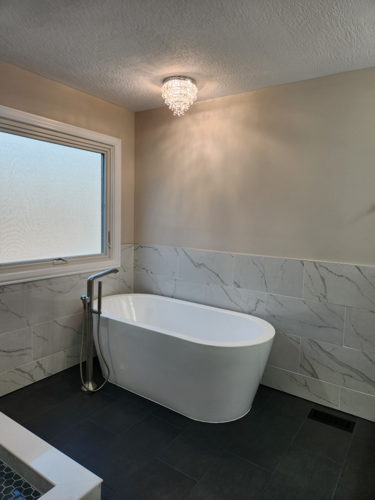 Freestanding bathtub - modern white tile ceramic tile and gray floor freestanding bathtub idea in Columbus