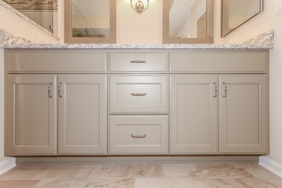 Design ideas for a large transitional master bathroom in Chicago with recessed-panel cabinets, beige cabinets, an alcove shower, a two-piece toilet, beige tile, ceramic tile, beige walls, ceramic floors, a drop-in sink, engineered quartz benchtops, beige floor, a hinged shower door and beige benchtops.