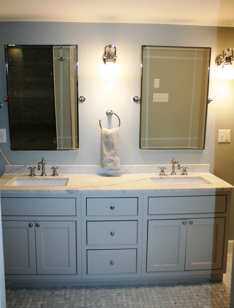 Photo of a large traditional master bathroom in Boston with flat-panel cabinets, grey cabinets, a freestanding tub, gray tile, mosaic tile, grey walls, mosaic tile floors, a vessel sink and marble benchtops.