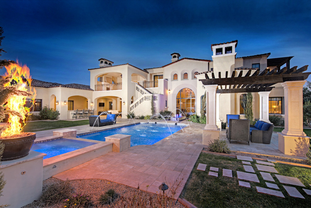 Huge tuscan backyard rectangular and stone natural pool fountain photo in Phoenix
