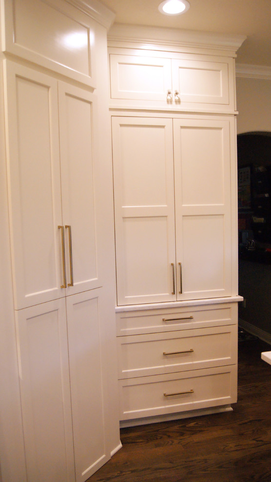 Inspiration for a transitional kitchen remodel with flat-panel cabinets, white cabinets, quartz countertops, gray backsplash and white countertops
