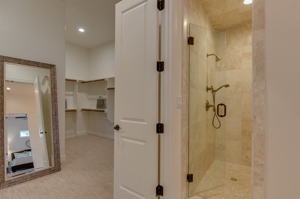 Inspiration for a large mediterranean master bathroom in Dallas with an undermount sink, white cabinets, granite benchtops, a drop-in tub, an alcove shower, a one-piece toilet, beige tile, terra-cotta tile, white walls and porcelain floors.