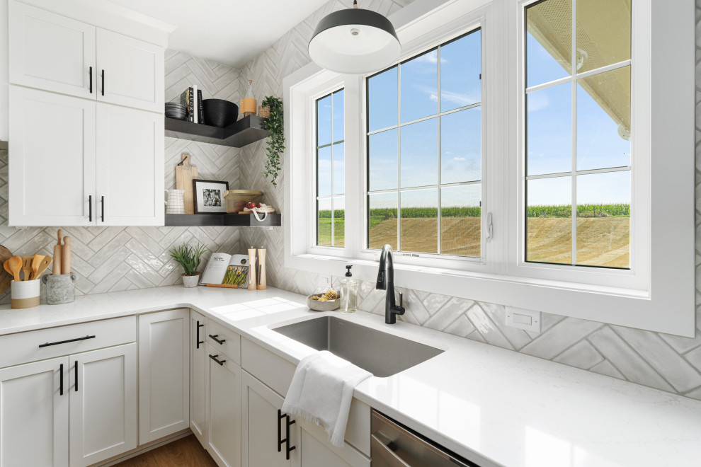 Kitchen - large transitional kitchen idea with white cabinets and an island