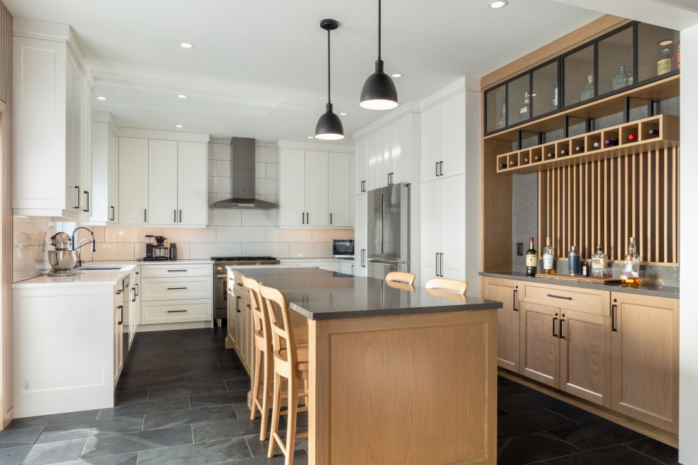 Example of a transitional kitchen design in Toronto