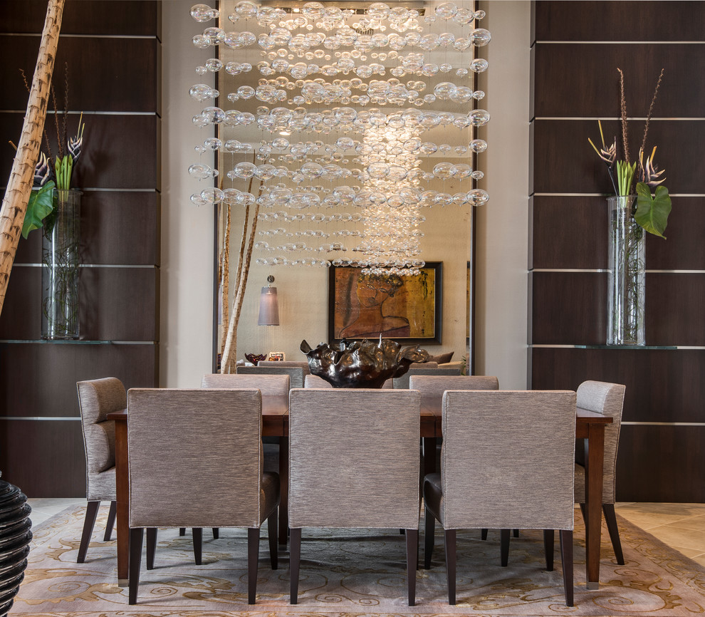 Inspiration for a large contemporary dining room in Miami with brown walls and no fireplace.