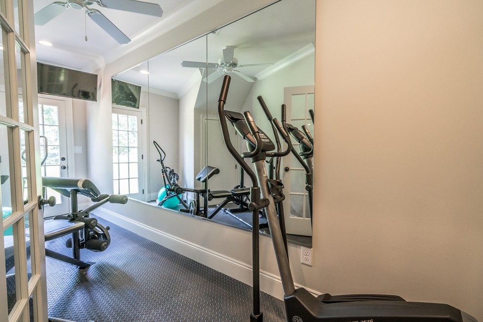 Small transitional home weight room in Atlanta with grey walls and grey floor.