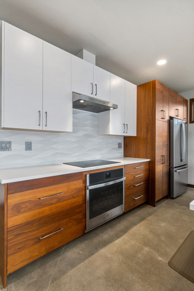 Medium sized classic kitchen/diner in Seattle with flat-panel cabinets, engineered stone countertops, stainless steel appliances and an island.