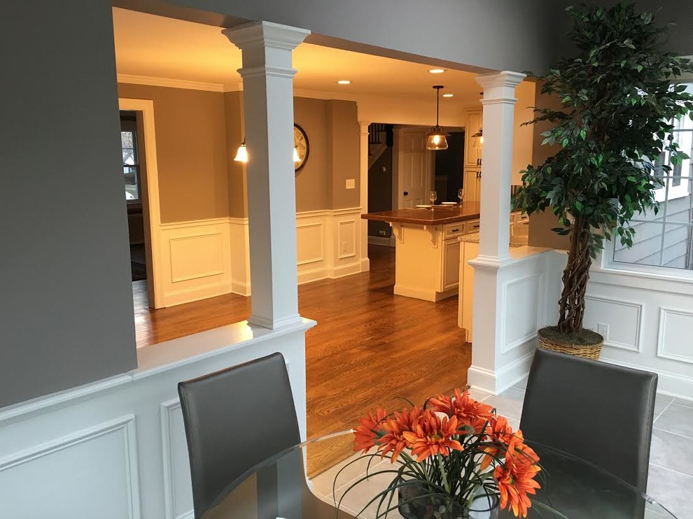 Enclosed dining room - mid-sized transitional ceramic tile and gray floor enclosed dining room idea in Bridgeport with gray walls and no fireplace