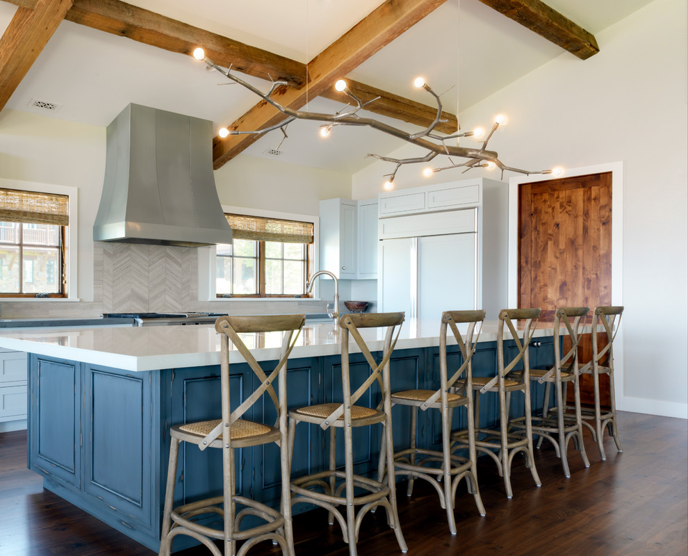 Large transitional l-shaped medium tone wood floor eat-in kitchen photo with beaded inset cabinets, blue cabinets, multicolored backsplash, stainless steel appliances and an island