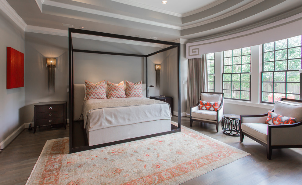 Inspiration for a large eclectic master bedroom in Houston with grey walls and medium hardwood floors.