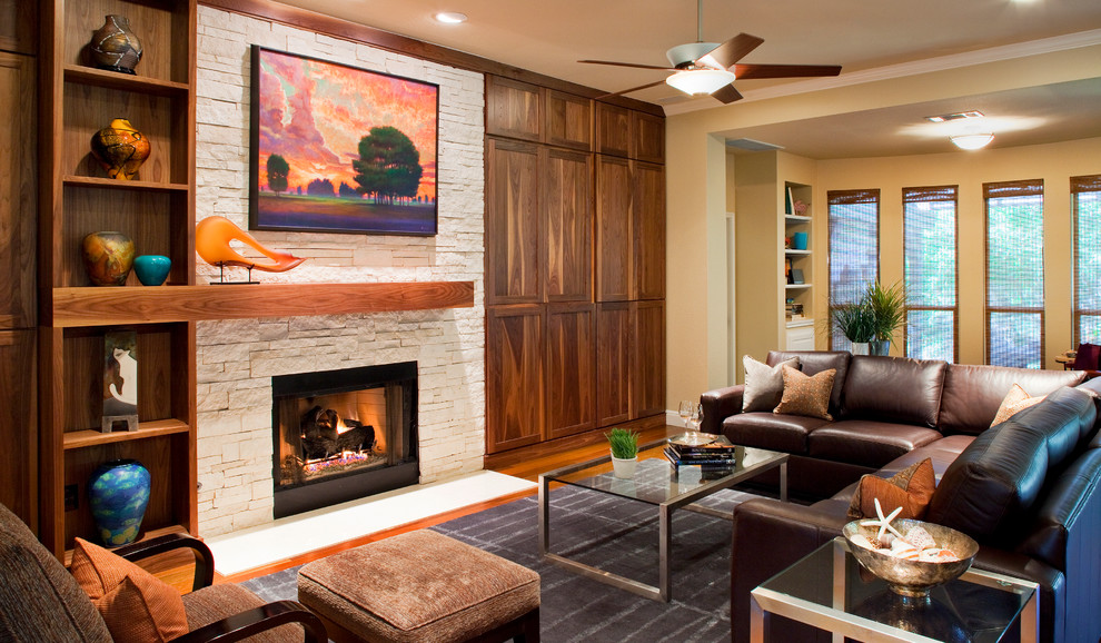 This is an example of a transitional formal living room in Austin with beige walls, dark hardwood floors, a standard fireplace and a stone fireplace surround.