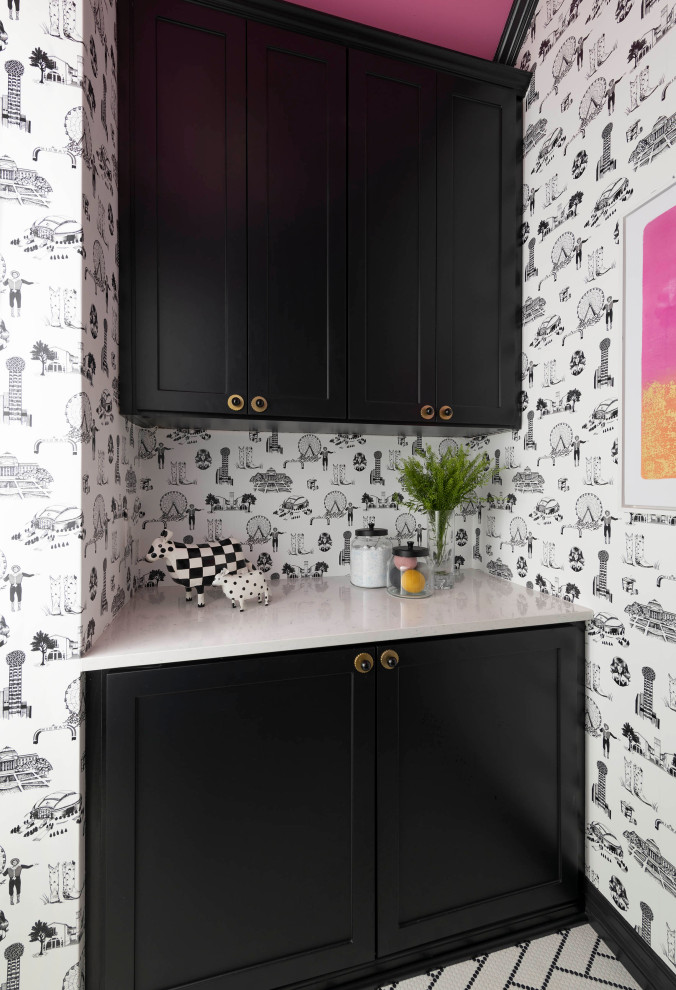 Inspiration for a midcentury galley dedicated laundry room in Dallas with black cabinets, multi-coloured walls, multi-coloured floor, white benchtop and wallpaper.