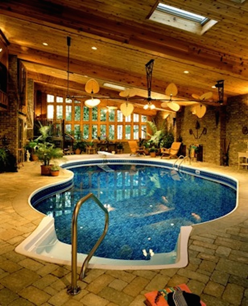 Inspiration for a mid-sized contemporary indoor stone and custom-shaped lap pool house remodel