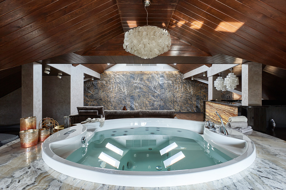 Inspiration for a contemporary round pool in Moscow with a hot tub.