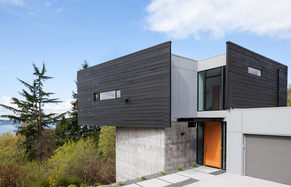 Inspiration for a contemporary exterior in Seattle with a flat roof.