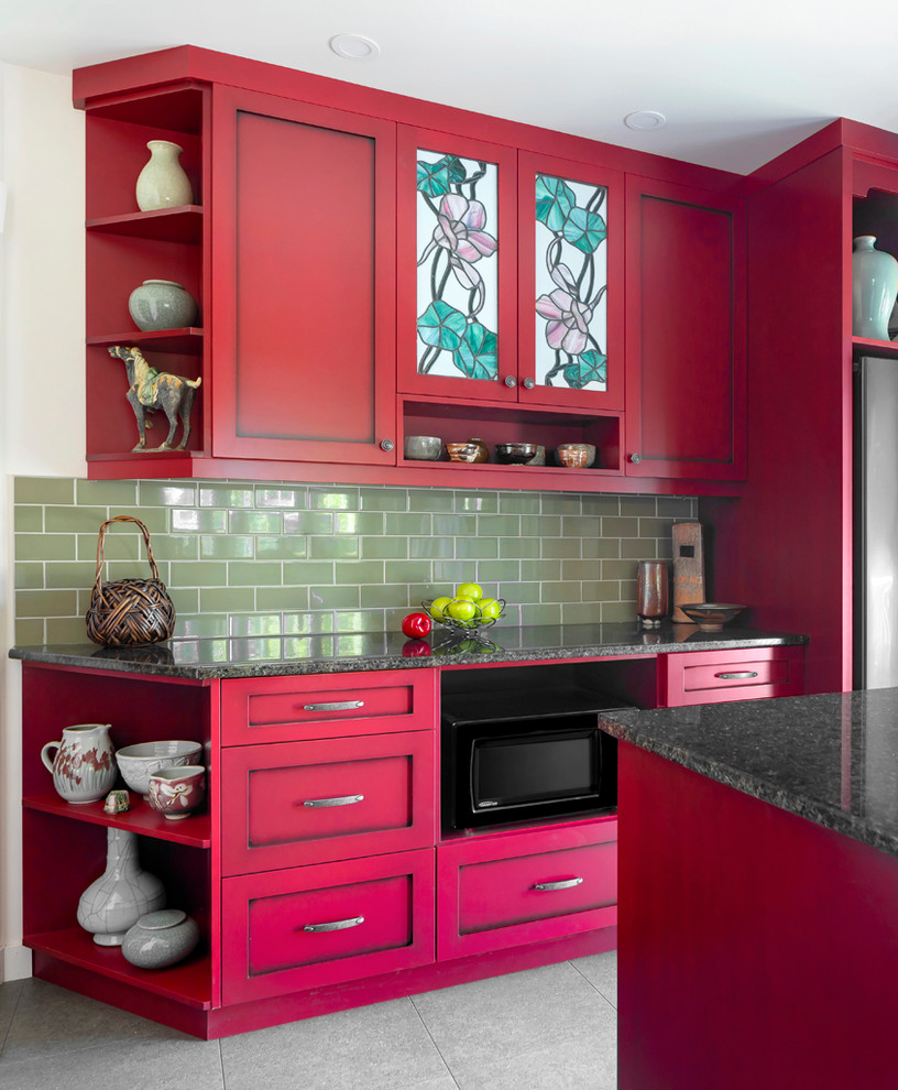 Mid-sized arts and crafts u-shaped separate kitchen in Other with shaker cabinets, red cabinets, quartz benchtops, green splashback, ceramic splashback, stainless steel appliances, with island, black benchtop, an undermount sink, ceramic floors and grey floor.