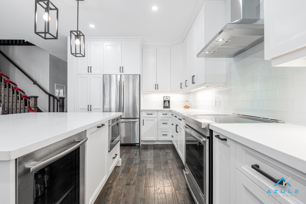 Inspiration for a large transitional u-shaped eat-in kitchen remodel with recessed-panel cabinets, white cabinets, quartz countertops, white backsplash, cement tile backsplash, an island and white countertops