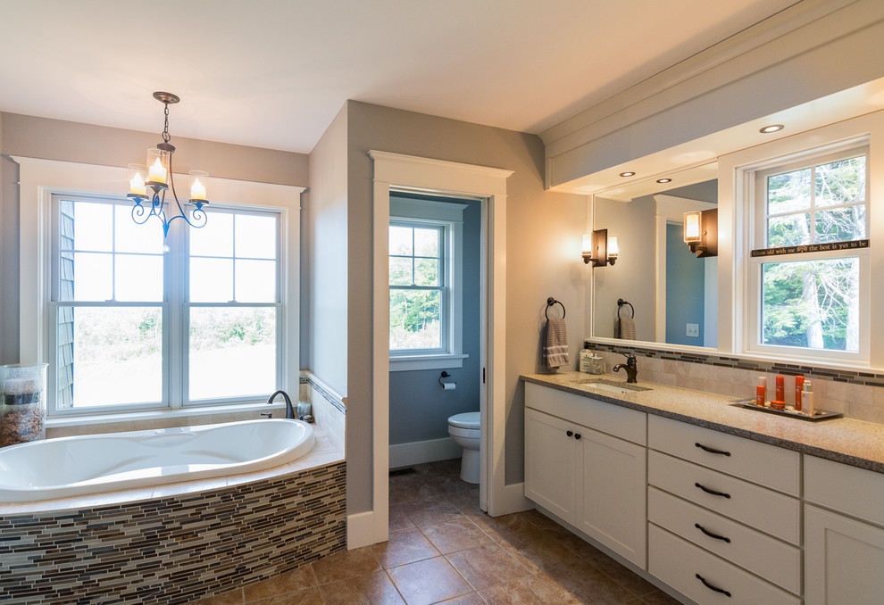 Large arts and crafts master bathroom in Portland Maine with shaker cabinets, white cabinets, an alcove tub, brown tile, grey walls, an undermount sink, granite benchtops, matchstick tile, ceramic floors, an open shower and brown floor.