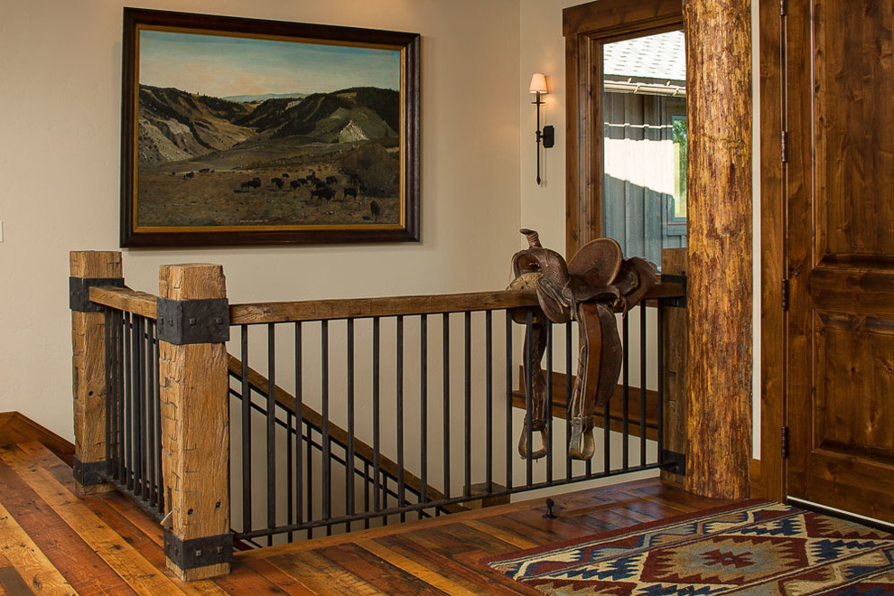 Hallway - mid-sized rustic dark wood floor hallway idea with beige walls