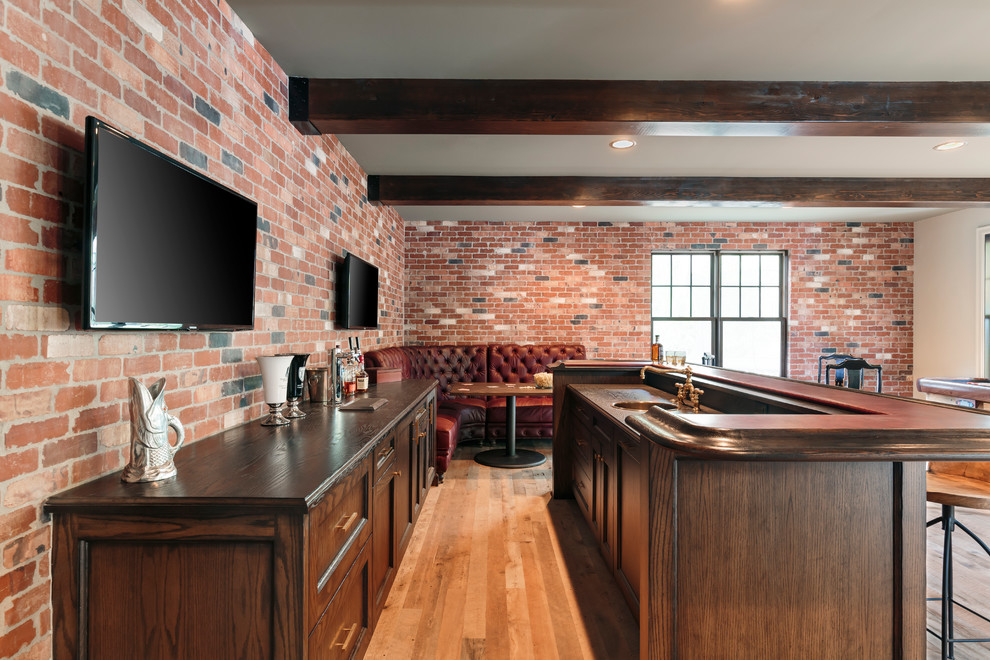 Inspiration for a large industrial l-shaped home bar in Portland with an undermount sink, dark wood cabinets, wood benchtops and brown benchtop.