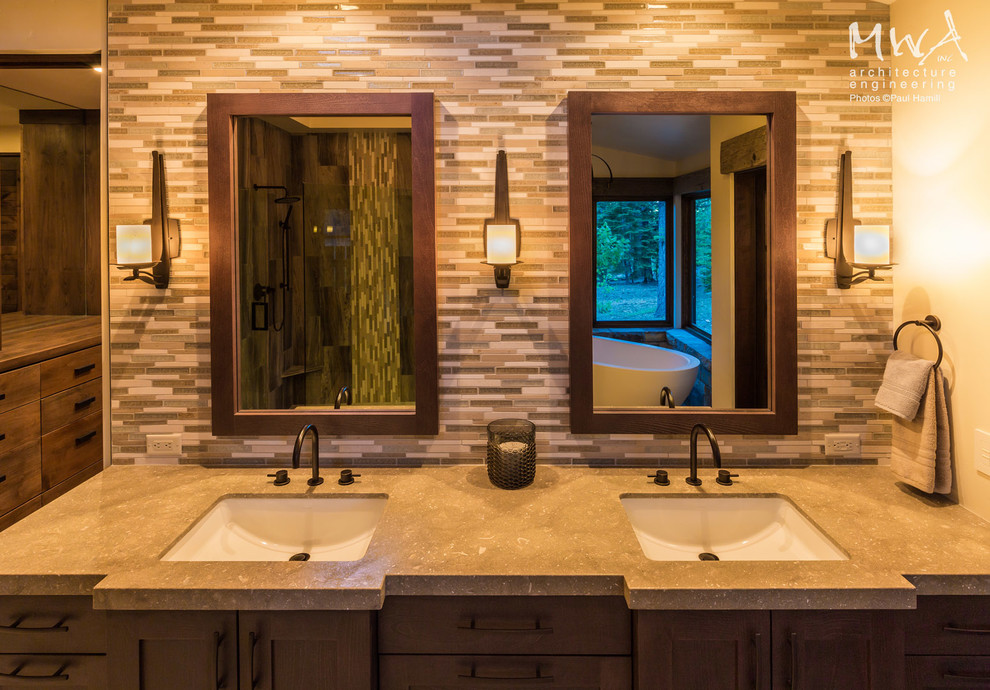 Large contemporary master bathroom in Other with shaker cabinets, dark wood cabinets, a freestanding tub, multi-coloured tile, an undermount sink, glass tile, beige walls and beige benchtops.
