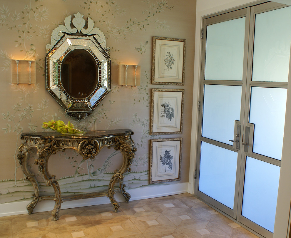 This is an example of a traditional entryway in Dallas with beige walls and a double front door.