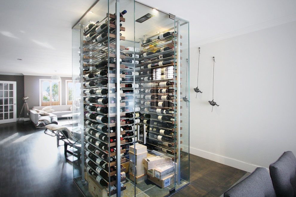 Small contemporary wine cellar in Other with slate floors, storage racks and grey floor.