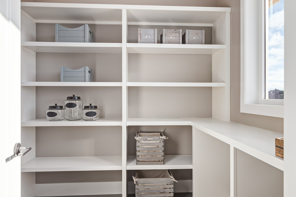 Inspiration for a mid-sized transitional galley kitchen pantry remodel in Calgary