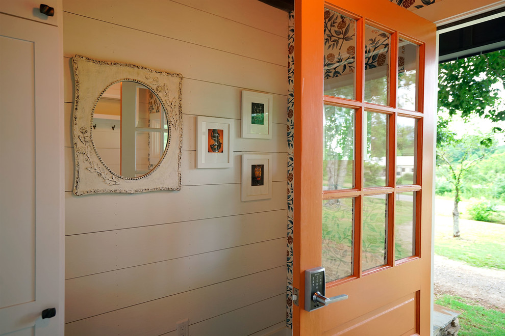 Design ideas for a small country mudroom in Other with white walls, dark hardwood floors, a single front door and an orange front door.