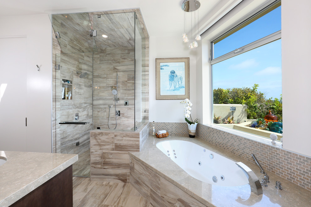 Inspiration for a transitional master bathroom in Orange County with an undermount sink, flat-panel cabinets, dark wood cabinets, limestone benchtops, a hot tub, a double shower, a one-piece toilet, beige tile, ceramic tile, white walls and ceramic floors.