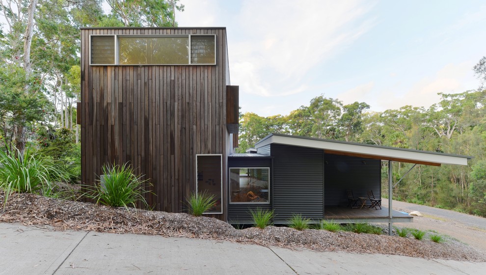 Inspiration for a beach style exterior in Sydney with metal siding.
