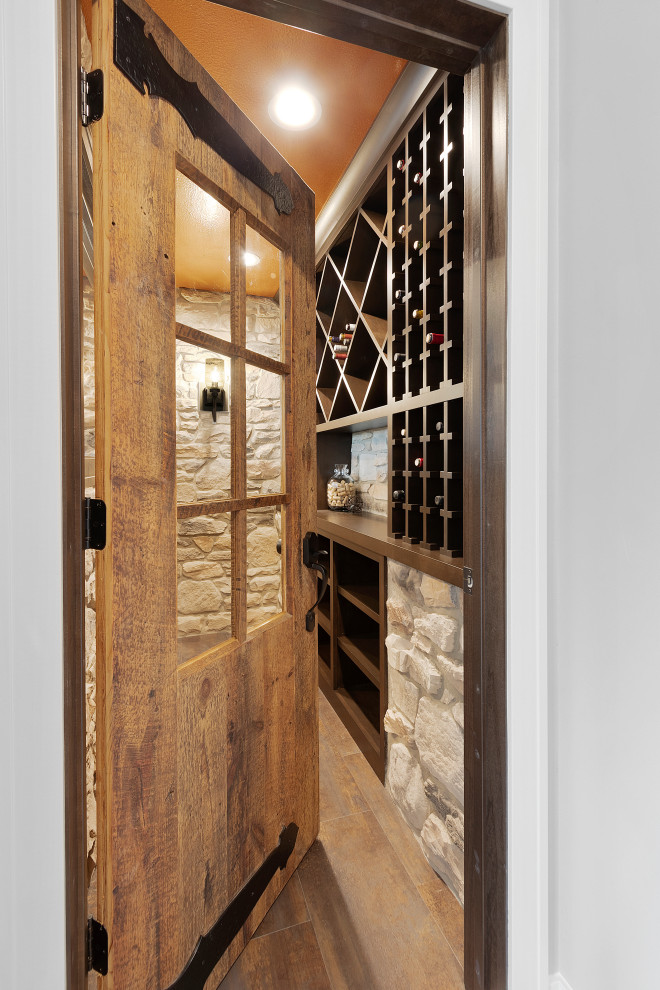 Inspiration for a small transitional wine cellar in Other with vinyl floors and diamond bins.