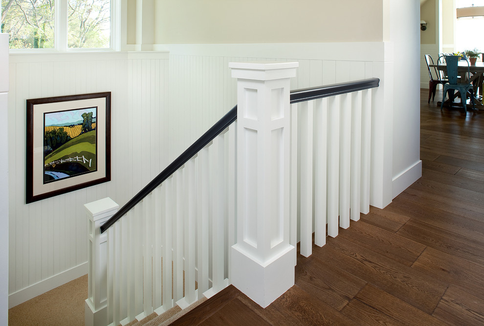 Design ideas for a large transitional u-shaped staircase in Grand Rapids with wood risers.