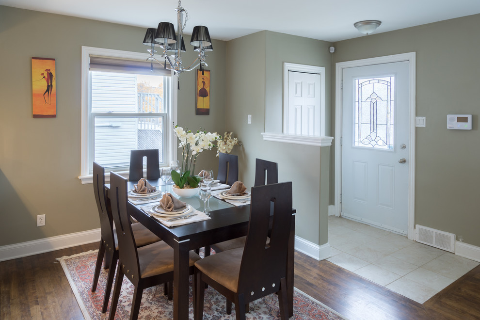 Example of a small transitional dark wood floor enclosed dining room design with gray walls and no fireplace