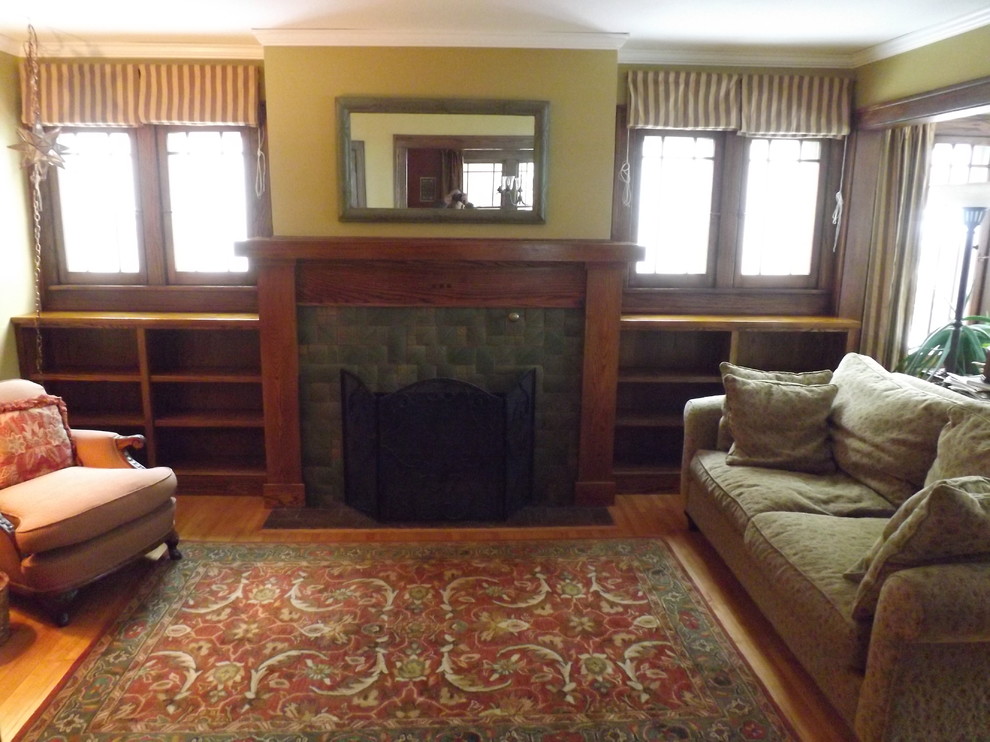 Photo of a mid-sized arts and crafts living room in Minneapolis with yellow walls, light hardwood floors, a standard fireplace, a tile fireplace surround and no tv.