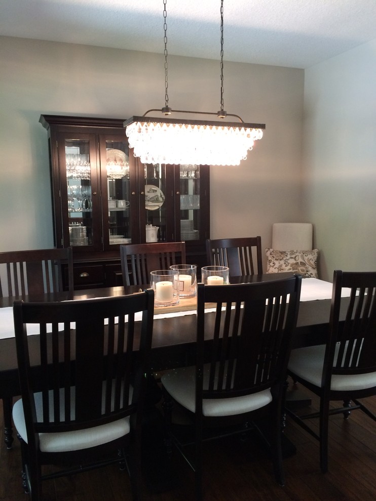 Inspiration for a mid-sized timeless dark wood floor enclosed dining room remodel in Minneapolis with gray walls and no fireplace