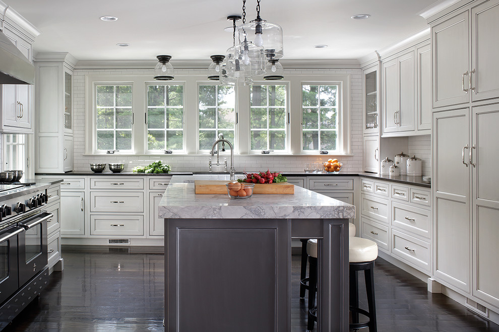 Enclosed kitchen - large transitional u-shaped dark wood floor enclosed kitchen idea with shaker cabinets, white cabinets and an island