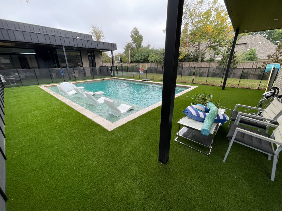 Inspiration for a mid-sized modern backyard rectangular pool in Dallas with with a pool.