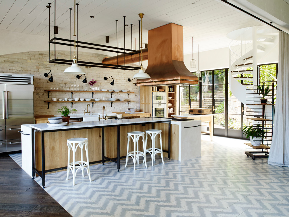 Inspiration for a transitional kitchen in Sydney with light wood cabinets, stainless steel appliances and with island.