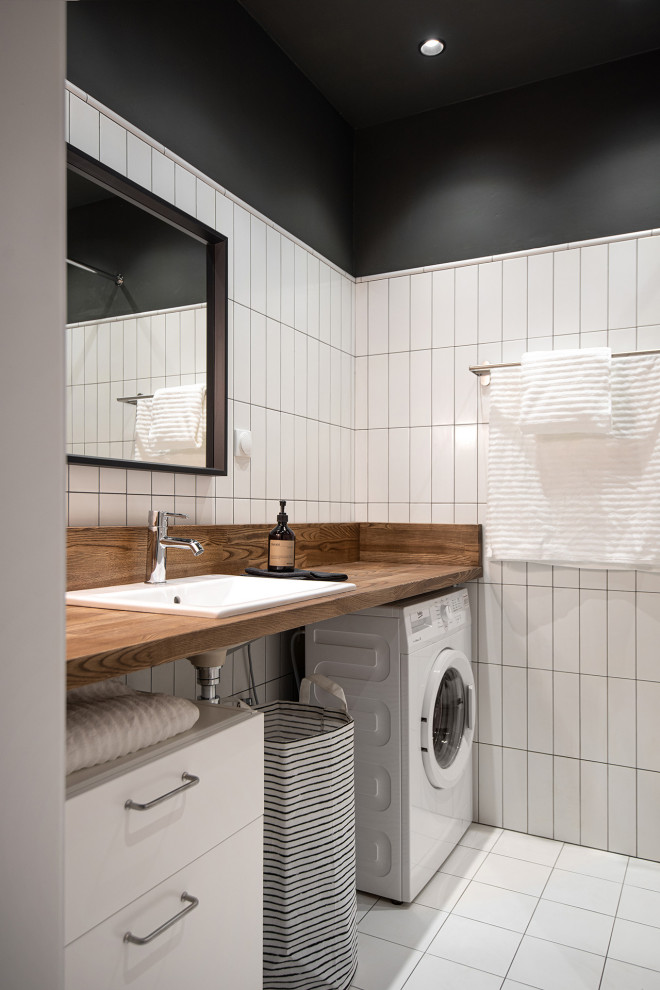 Inspiration for a small 3/4 bathroom in Saint Petersburg with flat-panel cabinets, an alcove shower, white tile, ceramic tile, white walls, ceramic floors, an undermount sink, wood benchtops, white floor, a shower curtain, brown benchtops and a single vanity.