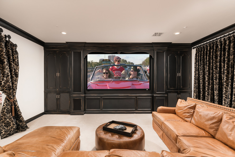 This is an example of an expansive traditional enclosed home theatre in Phoenix with white walls, carpet, a built-in media wall and beige floor.