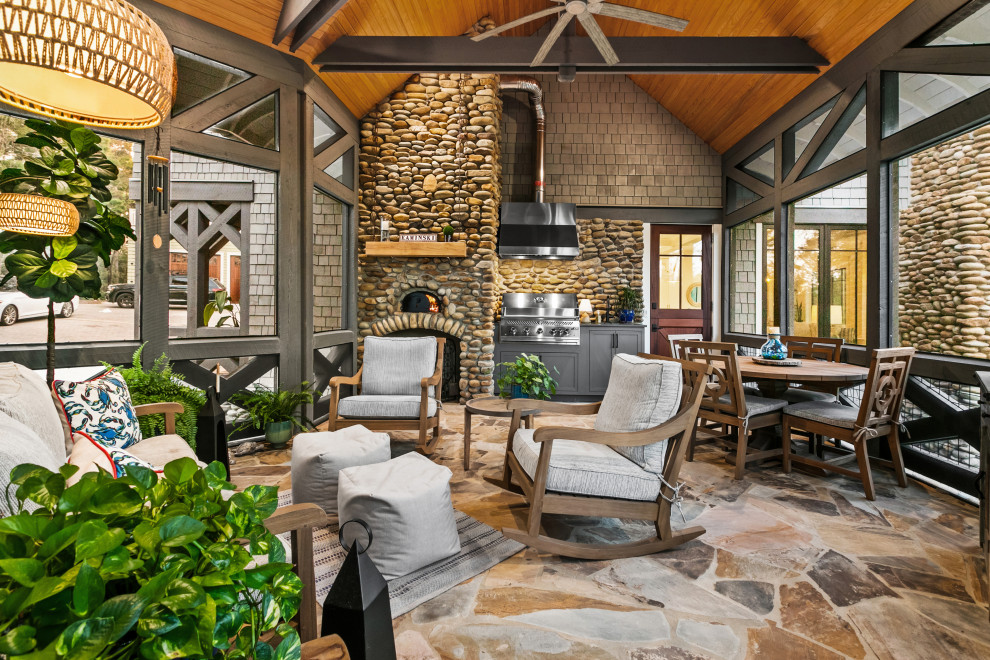 This is an example of a rustic porch design with a bbq area.