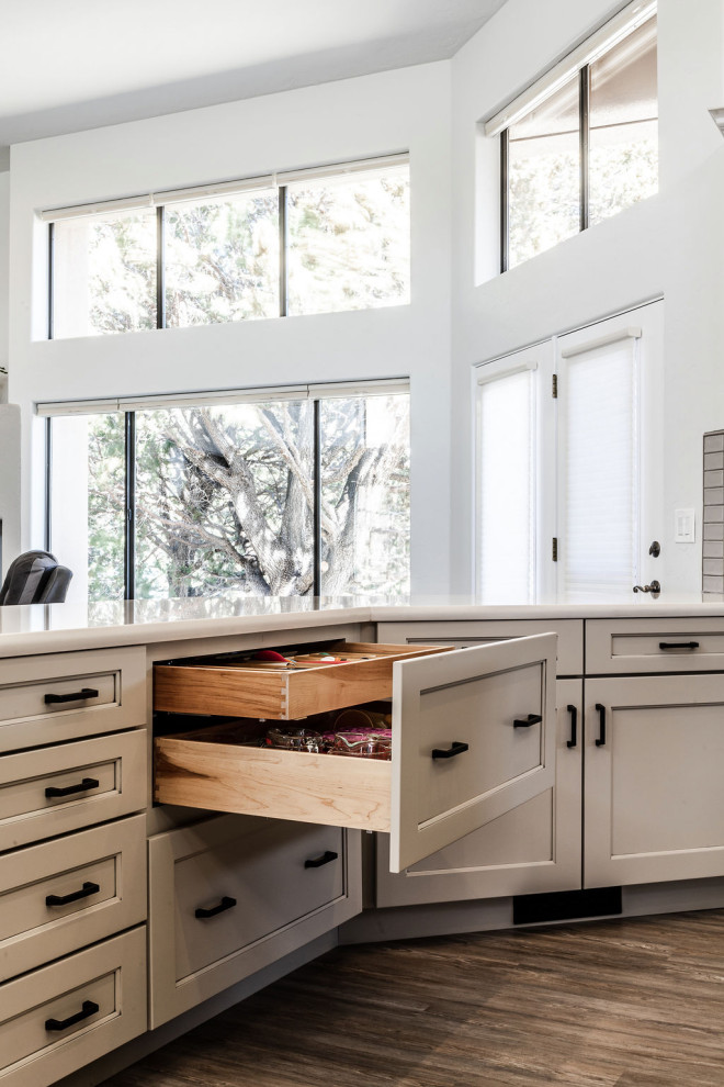 Eat-in kitchen - large transitional u-shaped vinyl floor and gray floor eat-in kitchen idea with an undermount sink, shaker cabinets, gray cabinets, quartzite countertops, green backsplash, subway tile backsplash, stainless steel appliances, an island and white countertops